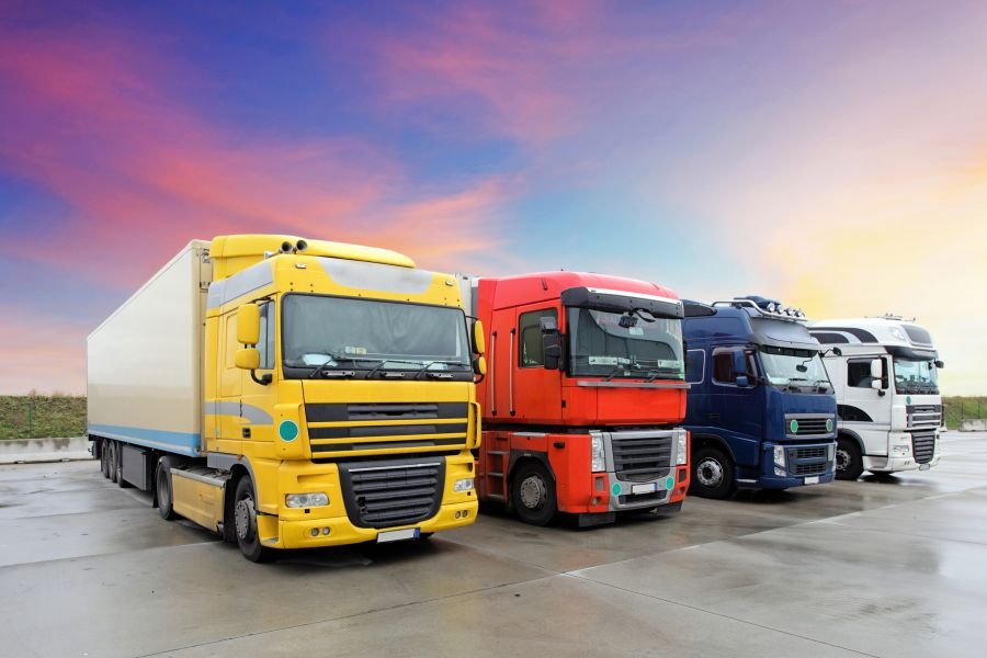 Tipper and bulk haulage trucks at dusk