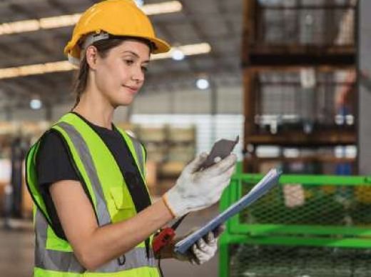 QC inspector recording inspection results on site