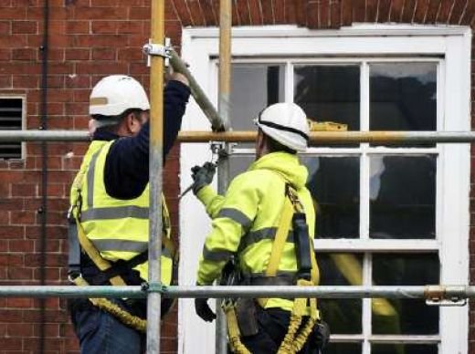 Scaffolders erecting an access scaffold