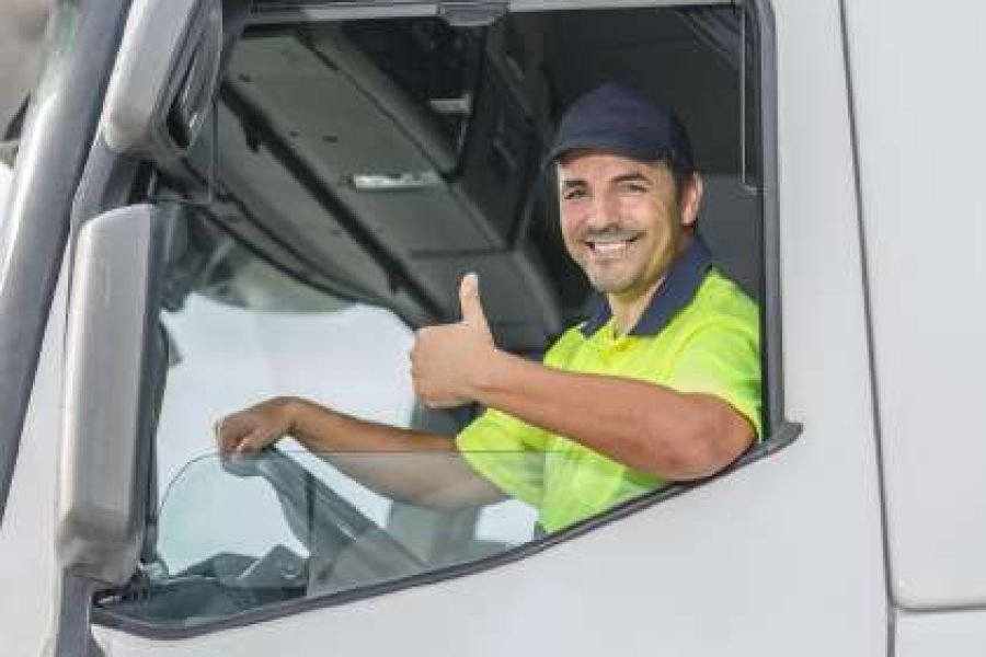 Professional truck driver in the cab of a heavy goods vehicle